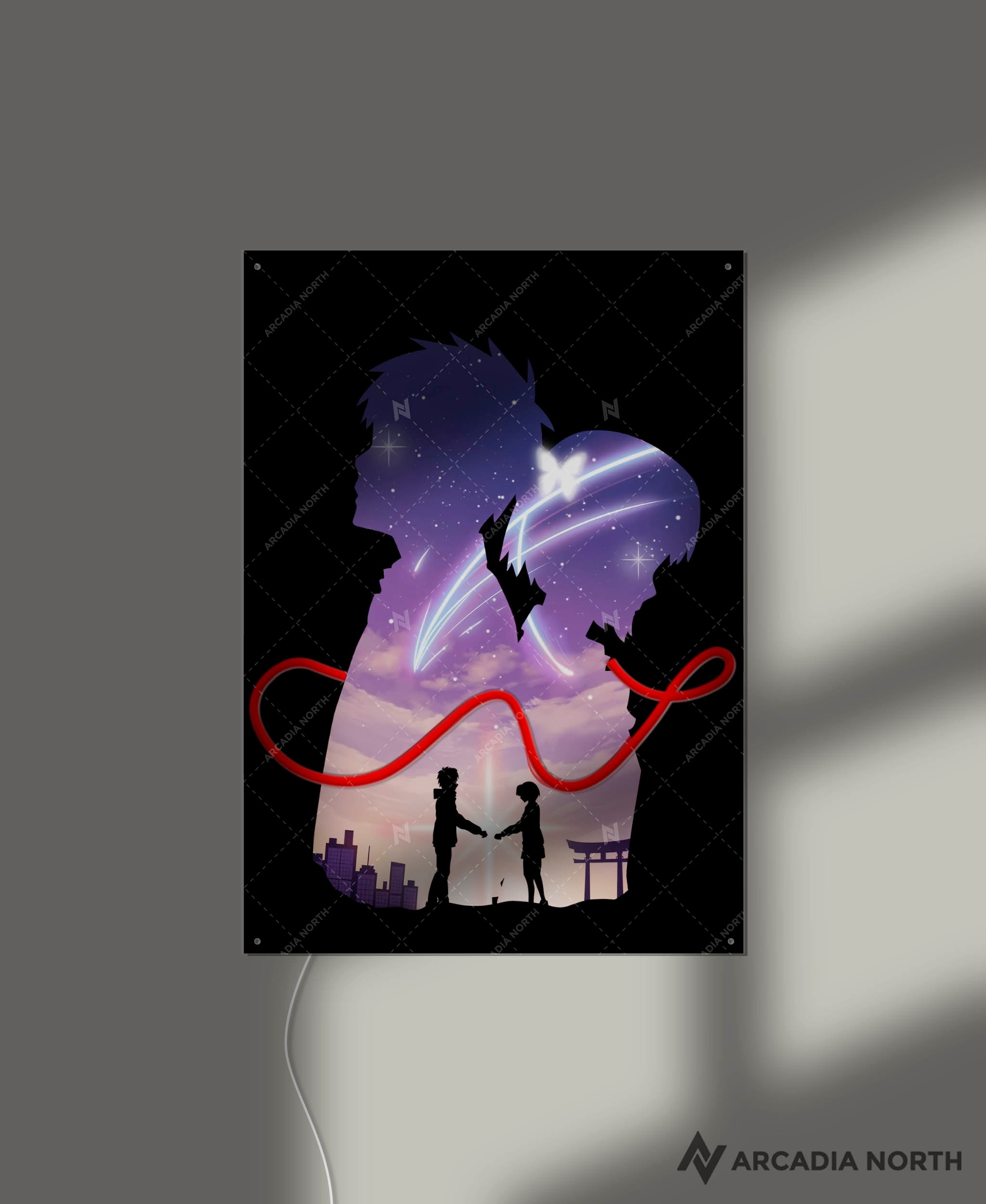 Arcadia North AURALIGHT - an LED Poster featuring the Makoto Shinkai anime Your Name Kimi no Na wa with Mitsuha and Taki connected by the red string of fate. Illuminated by glowing neon LED lights. UV-printed on acrylic.